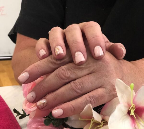 Hands with a nude gel polish manicure