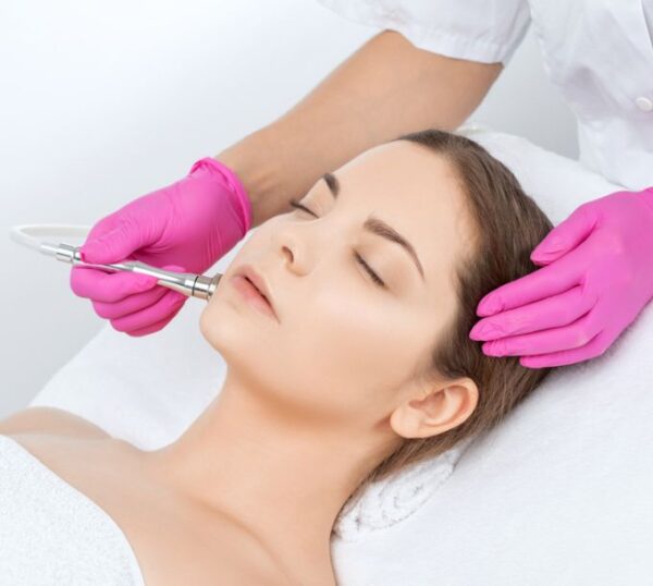 Client receiving a microdermabrasion facial