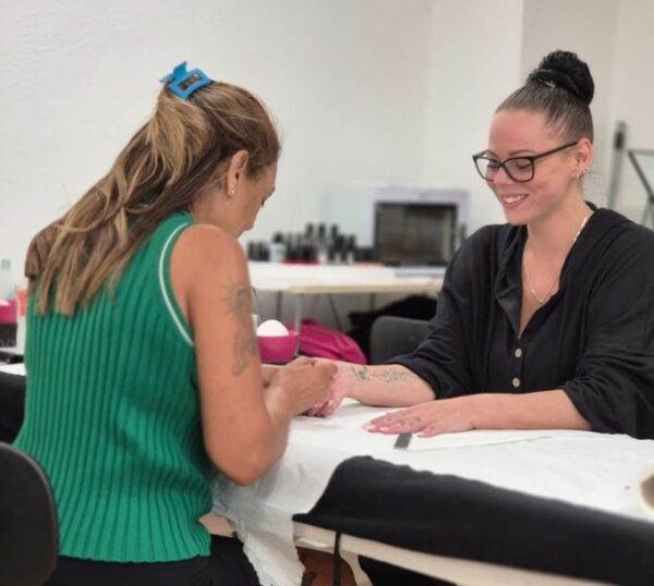 Tutor and student during a beauty training session