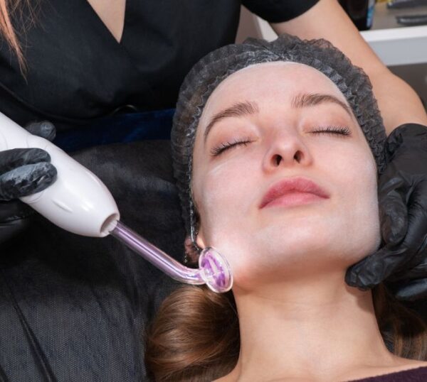Client receiving a high frequency electrical facial