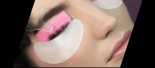 Korean lash lift with lashes set on a pink shield