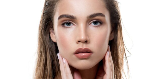 Woman with flawless skin and groomed brows