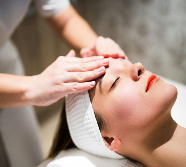 Client receiving a relaxing facial massage