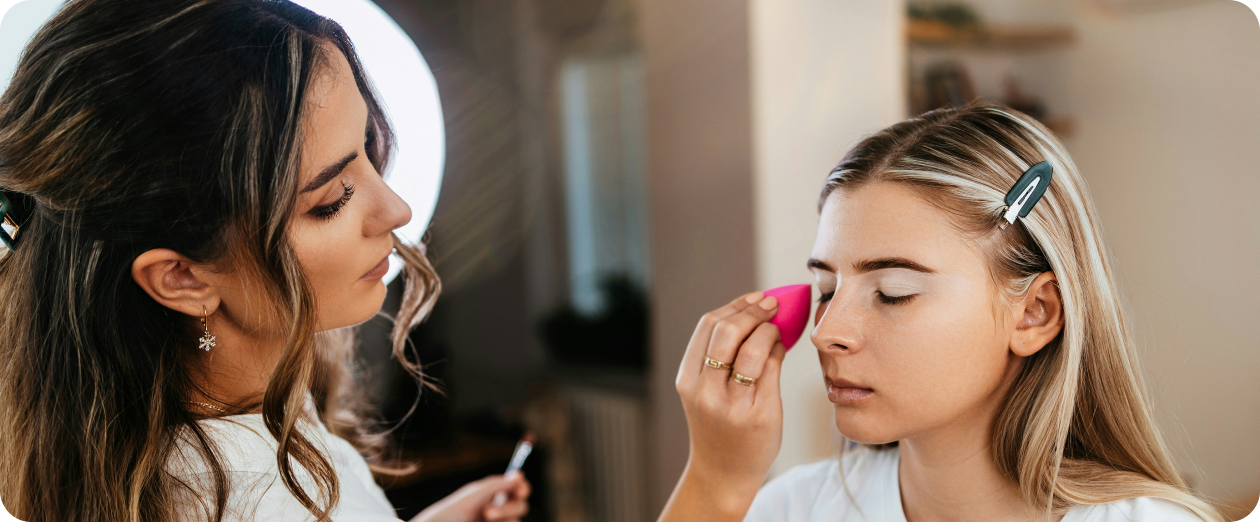 Make-up artist applying make-up with a sponge